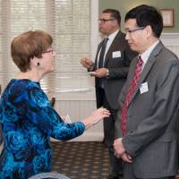 award winner talking to attendant